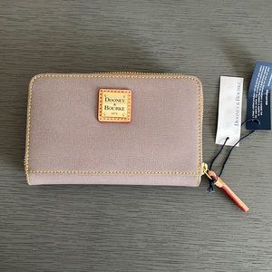 Dooney & Bourke zip around wallet. Taupe with red interior.